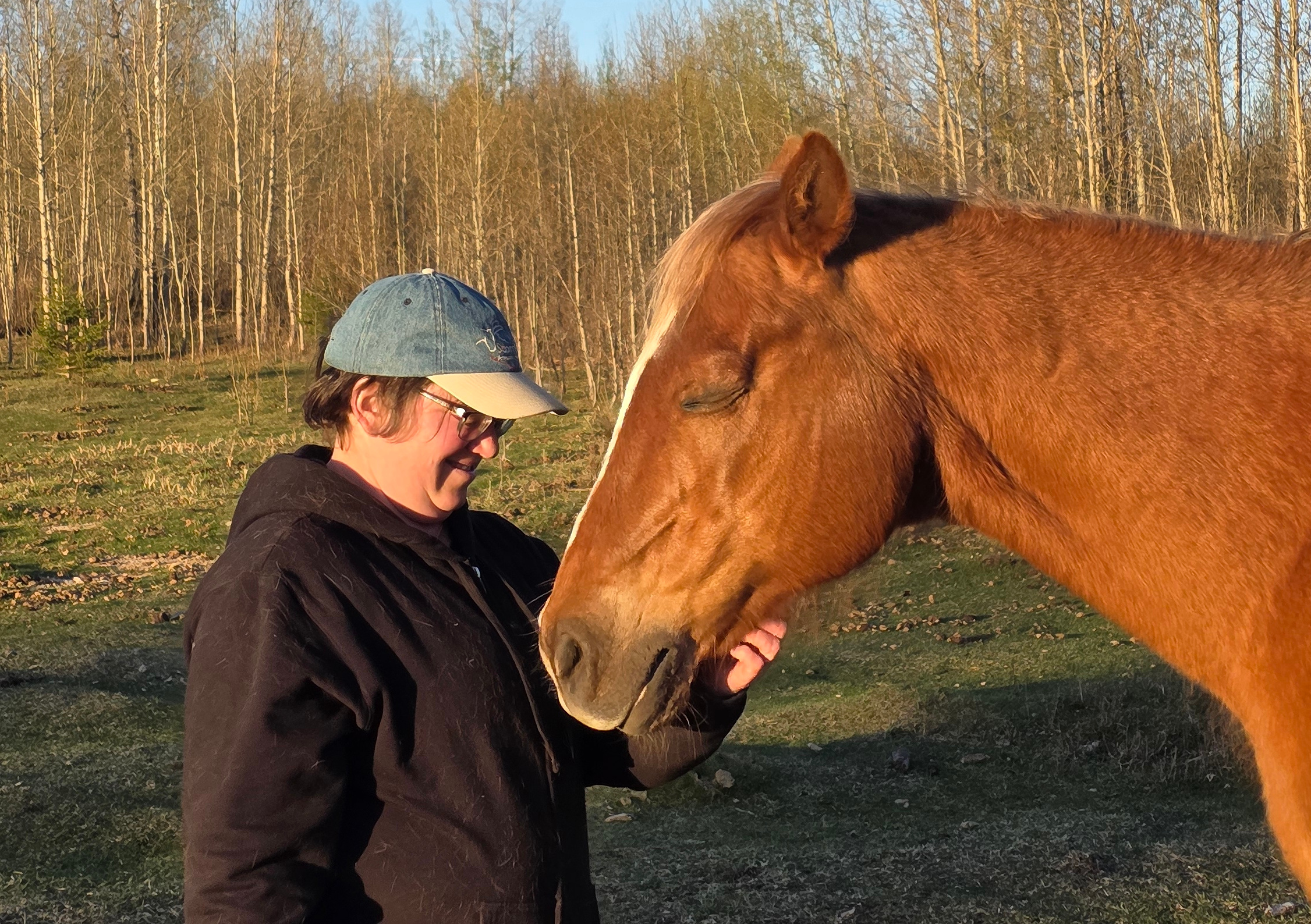 a woman loving a horse