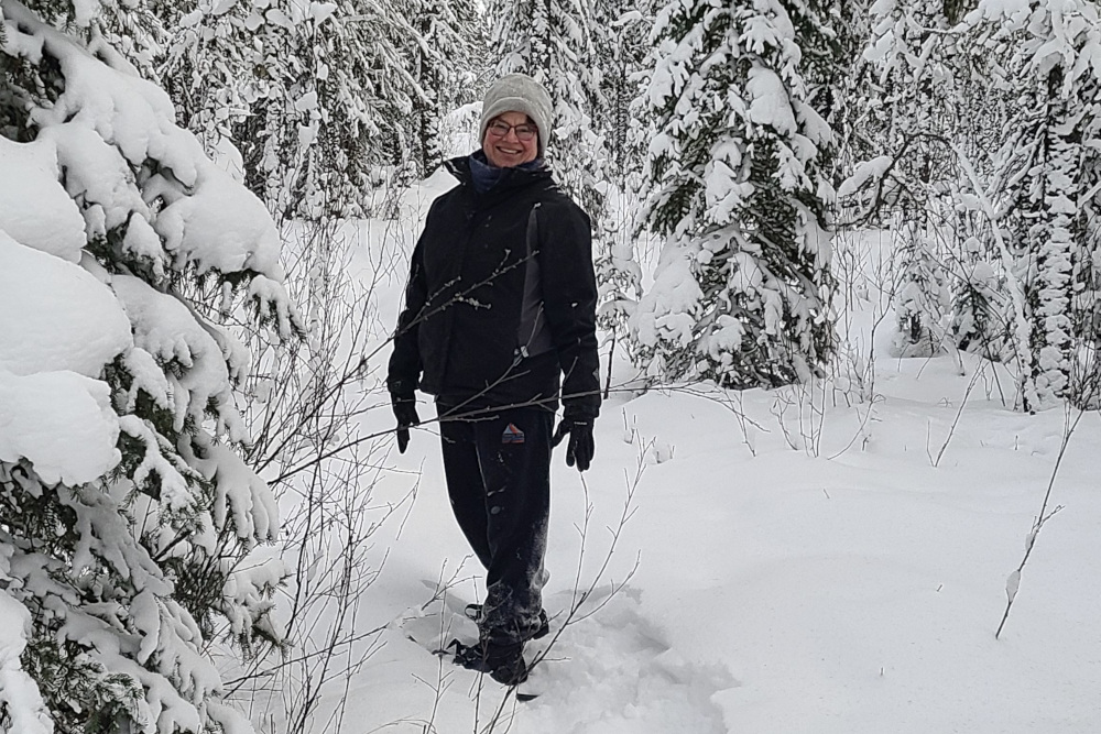 a woman snowshoeing